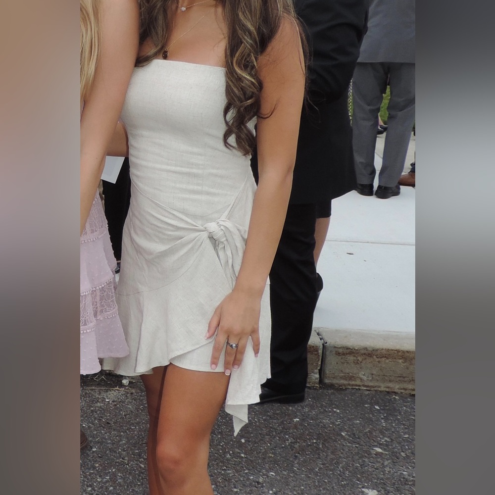 Strapless, cream mini dress.